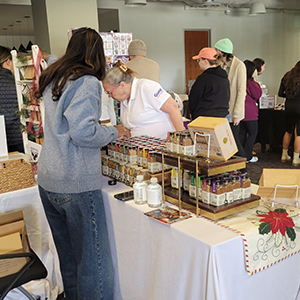 Woman working stand at holiday market
