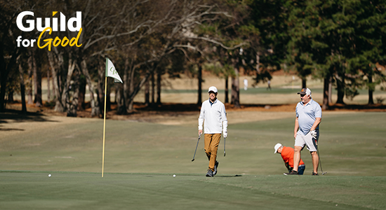 Guild employees walking on golf course in South Carolina